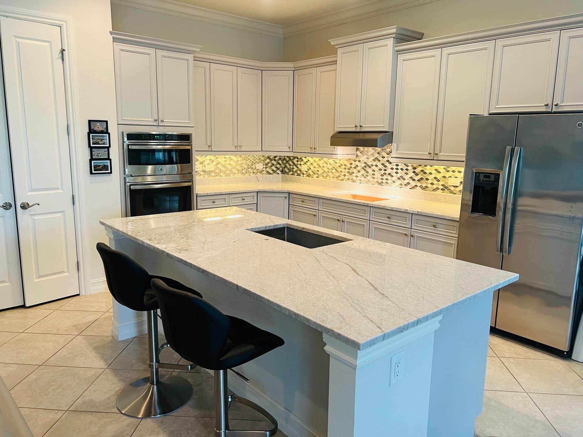 Quartz kitchen island fabricated and installed by J & L Kitchen Counters in Naples, Florida